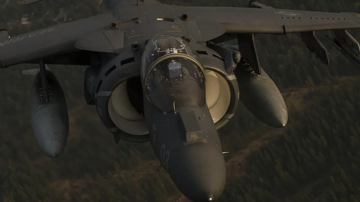 A military aircraft with a large engine and two missiles attached to its wings.